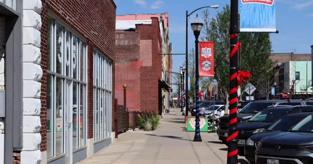Route 66 and Show Me America 250 banners line Historic Commercial Street in Springfield, MO.