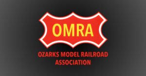 OMRA shield logo for the Ozarks Model Railroad Association in Springfield's Historic C-Street district.