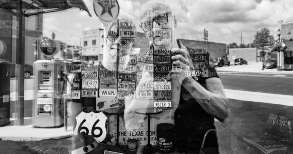 One Road Two Voices promo, a black and white Route 66 double exposure of gas pumps and a figure, Springfield, MO.