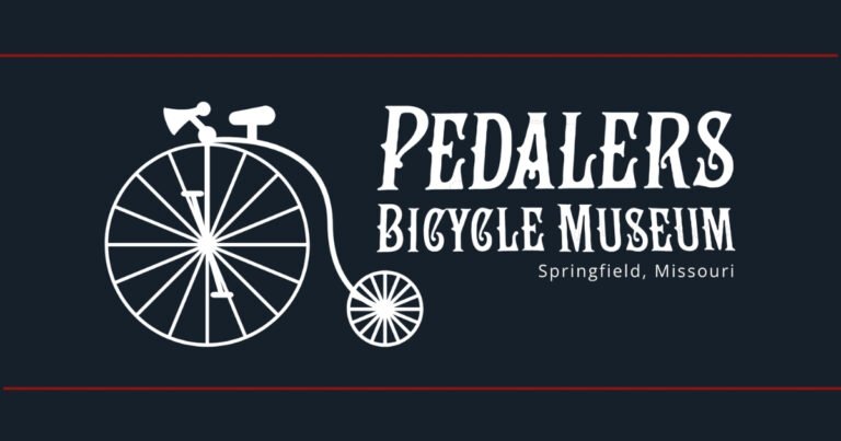 Pedalers Bicycle Museum logo with a penny-farthing, on Historic Commercial Street in Springfield, Missouri.