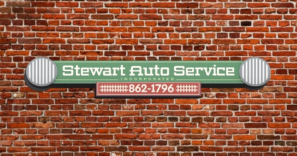 Stewart Auto Service sign on a brick wall, an auto repair shop serving the Historic C-Street area, Springfield.