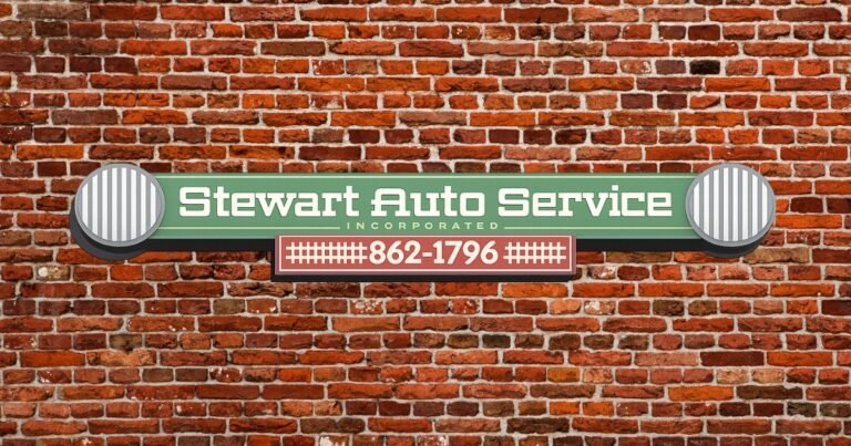 Stewart Auto Service sign on a brick wall, an auto repair shop serving the Historic C-Street area, Springfield.