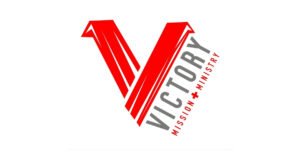 Victory Mission and Ministry logo with a bold red V, a Springfield nonprofit near Historic Commercial Street.