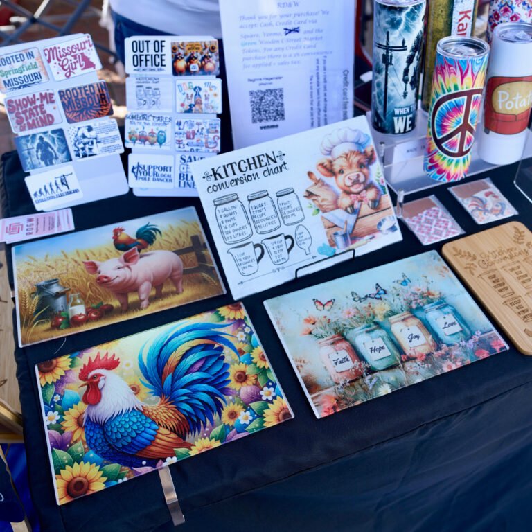 An RD&W booth of sublimated cutting boards, tumblers, and Missouri stickers at the C-Street market.