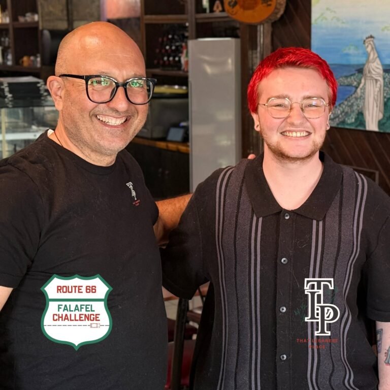 The That Lebanese Place owner and a Route 66 Falafel Challenge finisher smile for the camera.