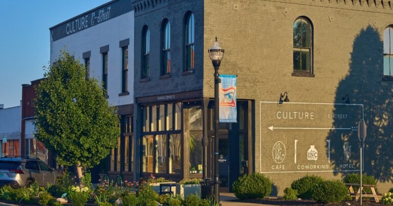 The Culture boutique hotel building on Historic Commercial Street with banners and a tree, Springfield, MO.