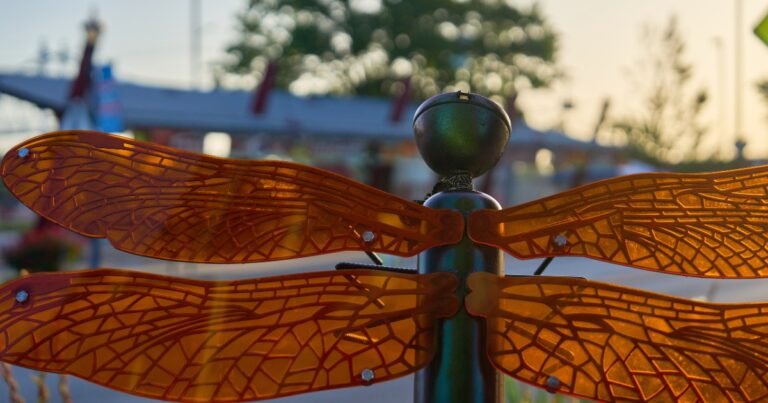 Close-up of a dragonfly art sculpture on a post along Historic Commercial Street, Springfield, MO.