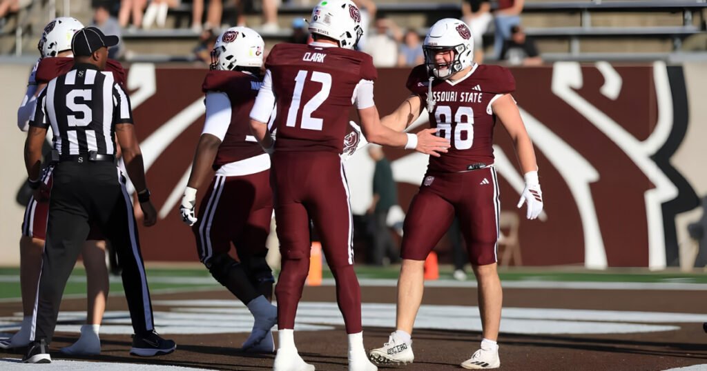 Missouri State football players on the field for College Football Week One at Mumbles1888, Springfield, MO.