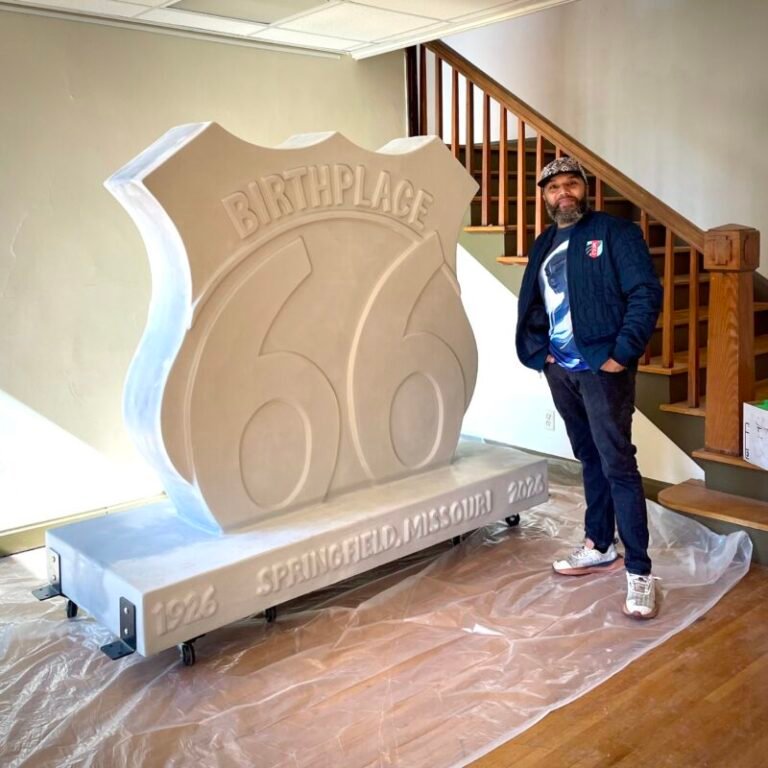 The unpainted Birthplace 66 Route 66 centennial sculpture with its artist before installation, Springfield, MO.