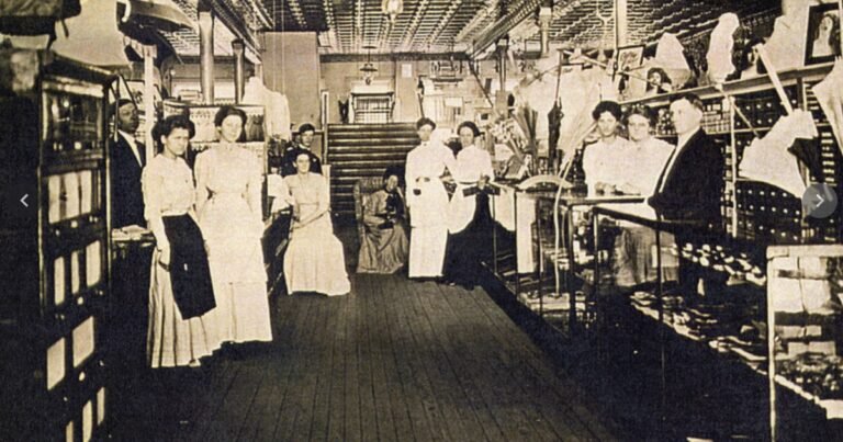 Historic interior of a Commercial Street dry goods store with staff among the shelves, Springfield, Missouri.