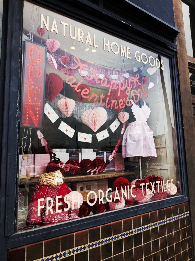 Valentine's shop window on Historic C-Street with natural home goods and textiles, Springfield, Missouri.